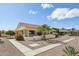 Single-story home boasts an inviting courtyard, desert landscaping, and a secure ADT system at 13942 W Summerstar Dr, Sun City West, AZ 85375