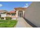 Charming single-story home with tile roof, desert landscaping and security gate at 13942 W Summerstar Dr, Sun City West, AZ 85375