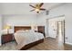 Spacious main bedroom with hardwood floors, a ceiling fan, and wooden furniture at 13942 W Summerstar Dr, Sun City West, AZ 85375