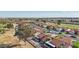 Overhead view of a quiet neighborhood street with homes featuring desert landscaping and red tile roofs at 13942 W Summerstar Dr, Sun City West, AZ 85375