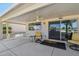 Covered patio featuring comfortable seating area to enjoy Arizona's weather at 13942 W Summerstar Dr, Sun City West, AZ 85375