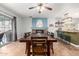 An open-concept dining room and kitchen featuring granite countertops and barstool seating at 14042 N 44Th St, Phoenix, AZ 85032