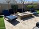 This backyard features a stone fire pit and two lounge chairs for relaxing outside at 1511 E Lynx Way, Gilbert, AZ 85298