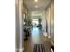 Elegant hallway with wood flooring, decorative mirrors, and contemporary furnishings at 1511 E Lynx Way, Gilbert, AZ 85298