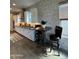 Kitchen with an eat-in area, white cabinets and a long stone backsplash that provides an elegant look at 1511 E Lynx Way, Gilbert, AZ 85298