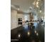 The kitchen has a large island and stylish pendant lighting to highlight a modern design at 1511 E Lynx Way, Gilbert, AZ 85298