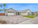 Stunning home showcasing a paver driveway, a 3-car garage, and a beautifully manicured lawn at 1547 E Crescent Way, Gilbert, AZ 85298