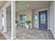 Inviting front porch with stone accents, comfortable seating, and a stylish entryway for a warm welcome at 1547 E Crescent Way, Gilbert, AZ 85298