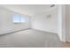 Spacious bedroom with plush carpeting, natural light from windows, and neutral color palette at 17253 W Via Dona Rd, Surprise, AZ 85387