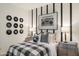 Bedroom featuring striped accent wall and an oversized boombox print, and matching dressers at 17742 W Brown St, Waddell, AZ 85355