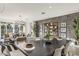 Elegant dining room with stylish decor, statement wall, modern chandelier, and comfortable seating at 17742 W Brown St, Waddell, AZ 85355