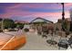 Outdoor patio with hot tub, seating, plants, and privacy wall, a perfect space to relax at 17810 W Club Vista Dr, Surprise, AZ 85374