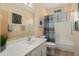 Bathroom features a shower/tub combo, neutral walls, and art at 17810 W Club Vista Dr, Surprise, AZ 85374