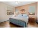 Comfortable bedroom features a wooden bed frame and side tables at 17810 W Club Vista Dr, Surprise, AZ 85374