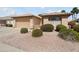 Charming home featuring a two-car garage, desert landscaping, and a beautiful tiled roof at 17810 W Club Vista Dr, Surprise, AZ 85374