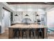 Well-lit kitchen with stainless steel appliances, granite counters, and an island with barstool seating at 18125 W Montebello Ct # 67, Litchfield Park, AZ 85340