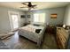 Tranquil bedroom with a ceiling fan, outdoor access, and natural light at 1815 S San Marcos Dr, Apache Junction, AZ 85120