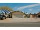 Charming exterior view of home with spacious driveway and convenient parking for multiple vehicles and RV at 1815 S San Marcos Dr, Apache Junction, AZ 85120