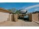 Home exterior highlighting parking beside house with RV and ATV, featuring secure fencing at 1815 S San Marcos Dr, Apache Junction, AZ 85120