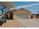 Charming single-story home with a two-car garage and desert landscaping at 1815 S San Marcos Dr, Apache Junction, AZ 85120