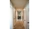 Hallway view featuring tile floors, neutral paint and white doors at 1815 S San Marcos Dr, Apache Junction, AZ 85120