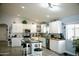 Bright, open kitchen with white cabinetry, an island, and modern appliances at 1815 S San Marcos Dr, Apache Junction, AZ 85120