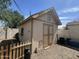 Exterior view of the shed featuring durable construction and a secure door, offering ample storage space at 1815 S San Marcos Dr, Apache Junction, AZ 85120