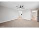 Spacious bedroom featuring neutral tones, plush carpet, and a modern ceiling fan at 2196 E Brigadier Dr, Gilbert, AZ 85298