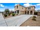 Inviting two-story home with a neutral stucco exterior, tile roof, and a concrete driveway at 2196 E Brigadier Dr, Gilbert, AZ 85298