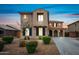 Charming two-story home featuring a tile roof, stucco facade, drought-tolerant landscaping, and a private driveway at 2196 E Brigadier Dr, Gilbert, AZ 85298