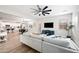 Spacious living room showcases an open-concept design with a modern ceiling fan and flows seamlessly into the kitchen at 2196 E Brigadier Dr, Gilbert, AZ 85298