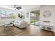 Bright living room with modern furnishings, a neutral-toned sofa and decorative coffee table set on a natural-fiber rug at 2196 E Brigadier Dr, Gilbert, AZ 85298