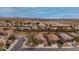 Scenic aerial view of a residential neighborhood featuring well-maintained homes and tree-lined streets at 25067 W Dove Trl, Buckeye, AZ 85326