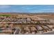 An aerial shot displays a subdivision with well-kept homes, green spaces, and convenient access to nearby amenities at 25067 W Dove Trl, Buckeye, AZ 85326