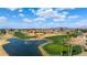 Wonderful aerial view of the golf course, green, and a beautiful community pond with a fountain at 2585 Leisure World --, Mesa, AZ 85206