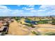 Expansive aerial view of the community golf course with a pond and walking path at 2585 Leisure World --, Mesa, AZ 85206