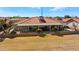 Aerial view of home with covered patio, block wall, and easy to maintain landscaping at 2585 Leisure World --, Mesa, AZ 85206