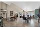 Bright dining area with tile flooring, high ceilings, and stylish lighting creates an inviting space to dine at 2585 Leisure World --, Mesa, AZ 85206