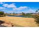 Scenic view of the golf course and pond with a fountain and lush landscaping at 2585 Leisure World --, Mesa, AZ 85206