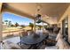 Covered patio with ample seating and views of the lake and golf course at 2585 Leisure World --, Mesa, AZ 85206