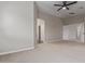 The spacious bedroom features neutral walls, carpet flooring, a ceiling fan, and closet access at 25872 W Hilton Ave, Buckeye, AZ 85326