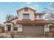 Attractive two-story house with a red tile roof and neutral stucco exterior at 25872 W Hilton Ave, Buckeye, AZ 85326