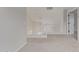 Open hallway boasts a white banister, neutral carpet, and a view of a vaulted ceiling at 25872 W Hilton Ave, Buckeye, AZ 85326