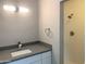 This bathroom has a gray quartz countertop and tiled shower at 2632 E Irwin Ave, Mesa, AZ 85204