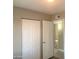 This bedroom has two doors, neutral walls, and an air conditioning vent at 2632 E Irwin Ave, Mesa, AZ 85204