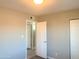 This bedroom has neutral walls, an open door, and an air conditioning vent at 2632 E Irwin Ave, Mesa, AZ 85204