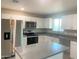 Beautiful kitchen with stainless steel appliances, granite countertops, and white cabinets at 2632 E Irwin Ave, Mesa, AZ 85204