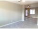 Spacious living room with tile flooring and neutral paint, and a ceiling fan for comfort at 2632 E Irwin Ave, Mesa, AZ 85204