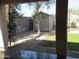 View of backyard featuring gravel, grass, shed, and block wall at 2830 W Grenadine Rd, Phoenix, AZ 85041