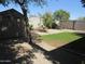 Backyard with a shed and low-maintenance desert landscaping at 2830 W Grenadine Rd, Phoenix, AZ 85041